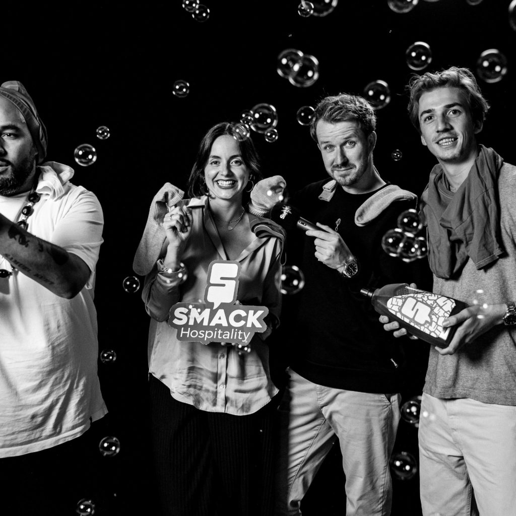 Smack Hosts posing for Dirty Laundry in between Soap Bubbles