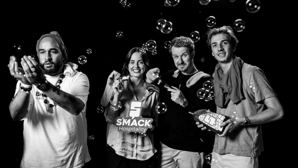 Smack Hosts posing for Dirty Laundry in between Soap Bubbles