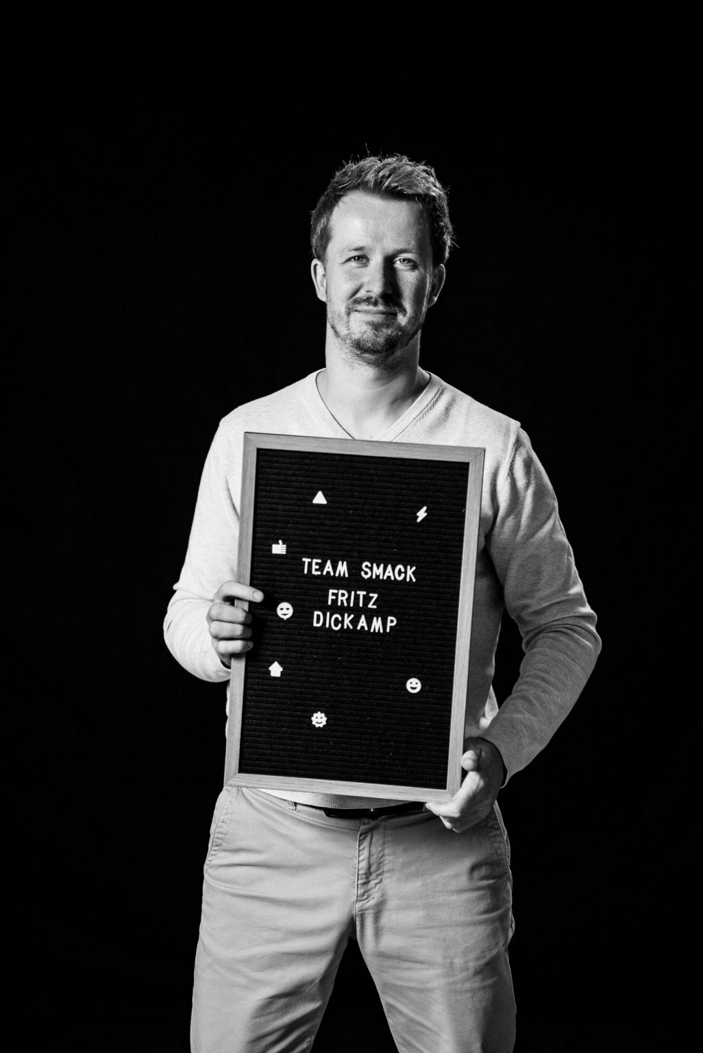 Fritz Dickamp holding his name sign for Smack Media